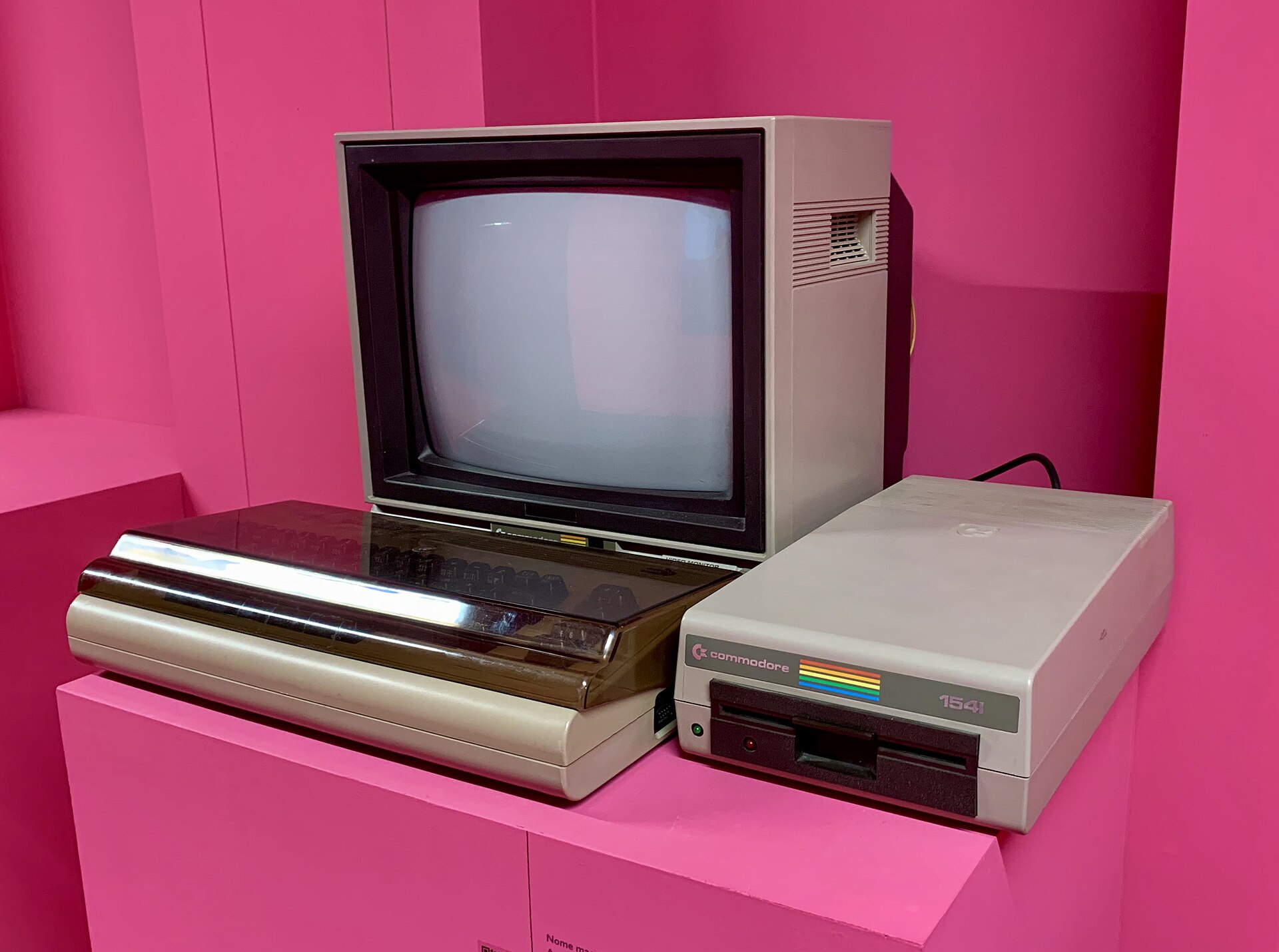 A Commodore 1541 floppy disk drive, a wide beige box with a horizontal disk slot and two indicator lights on the front.